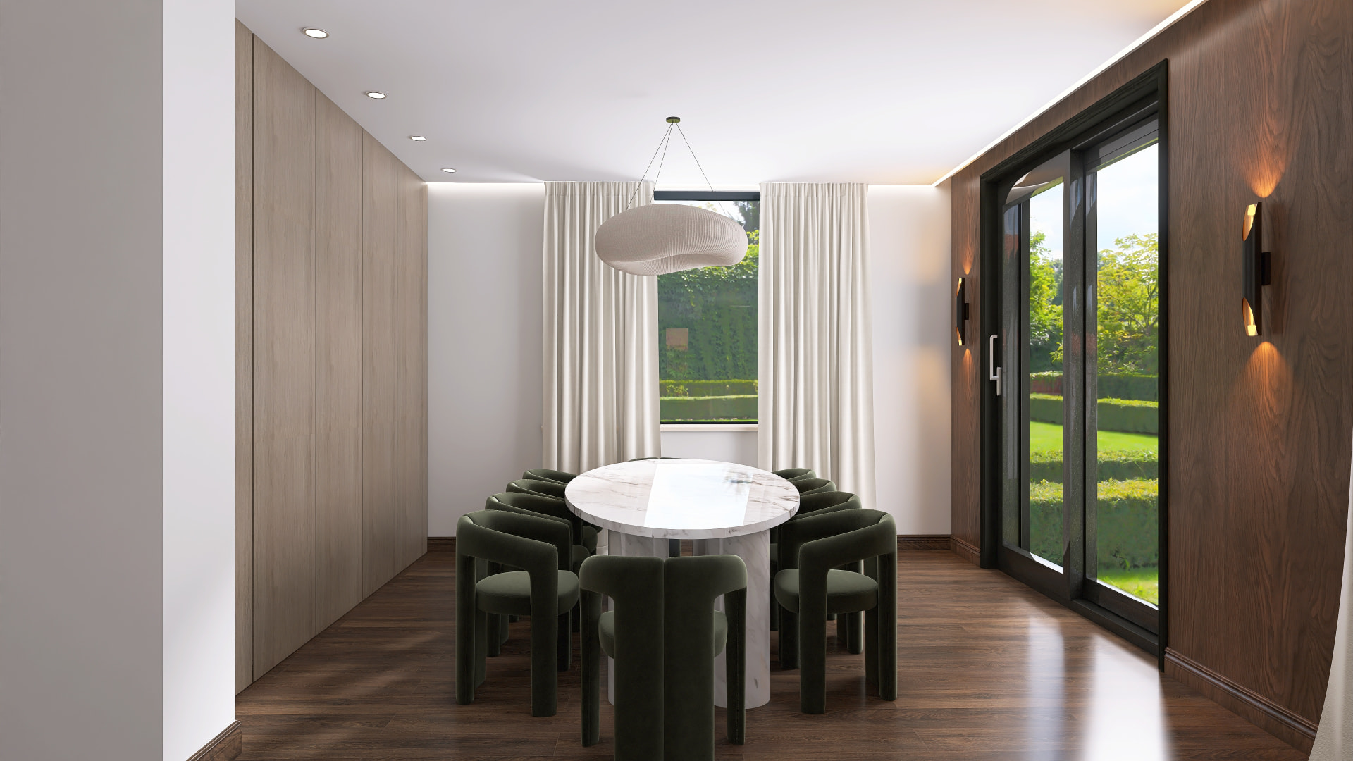 Dining room with round marble table, olive velvet chairs and oak joinery